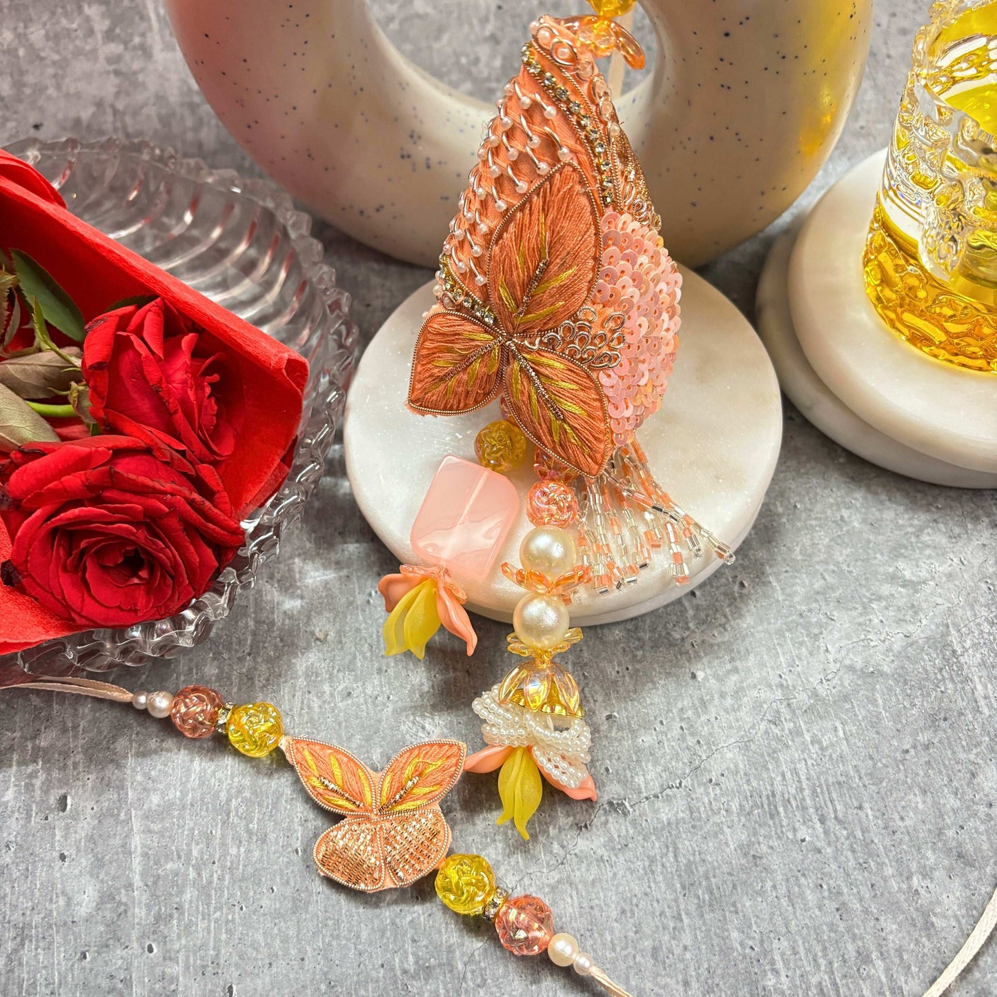 Designer Butterfly Rakhi with Latkan Rakhi for Bhaiya Bhabhi featuring vibrant colors and detailed embellishments