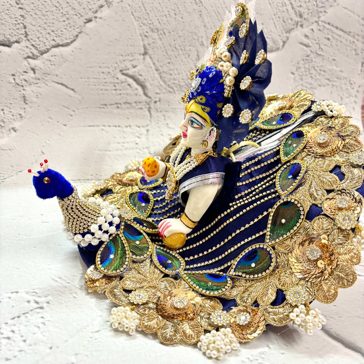 Laddu Gopal Poshak Tyohaarvibe elegantly adorned with blue peacock design and intricate embroidery
