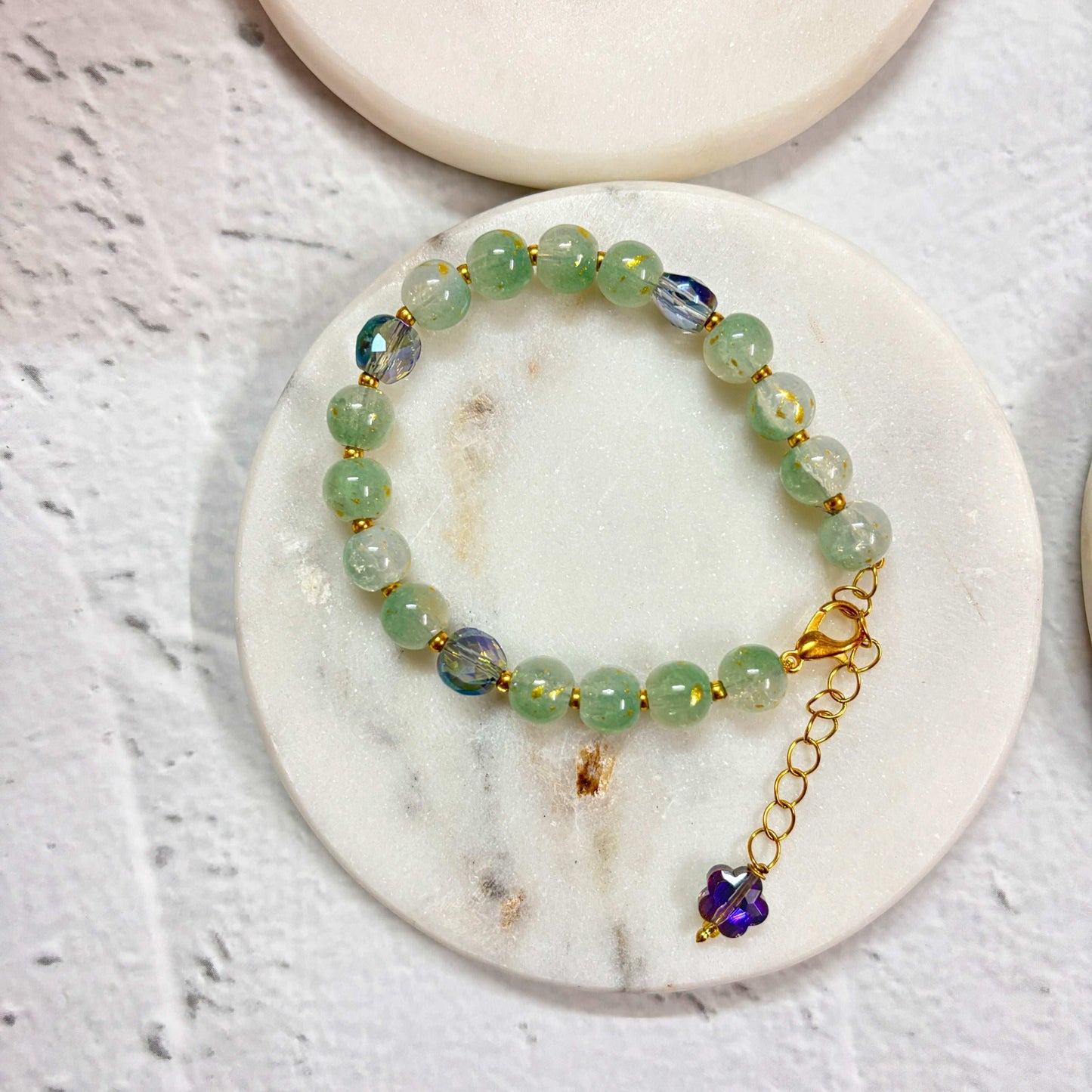 TyohaarVibe Marble Effect Beaded Bracelet Combo on marble display with green and blue beads