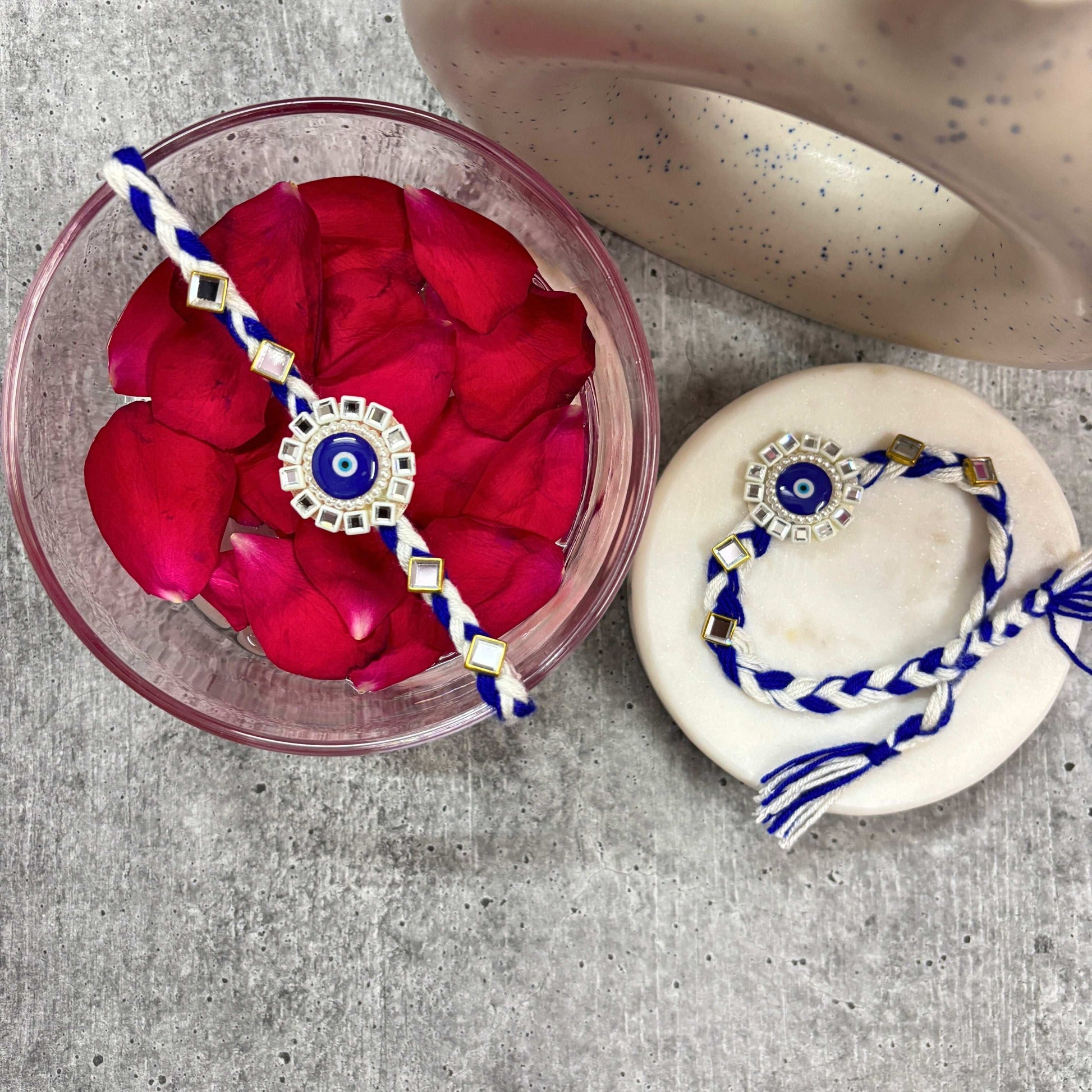 Evil Eye Designer Rakhi Raksha Bandhan 2025 with intricate design and vibrant colors on decorative plate